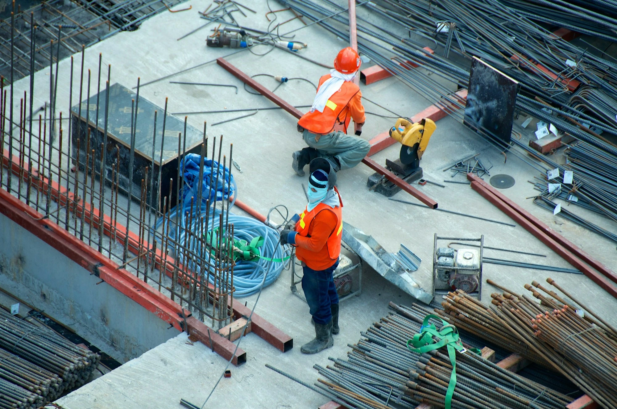 Construction professionals working on a reinforced concrete structure